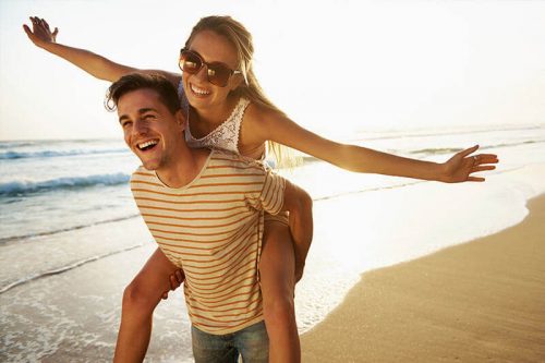 Happy young couple at the beach