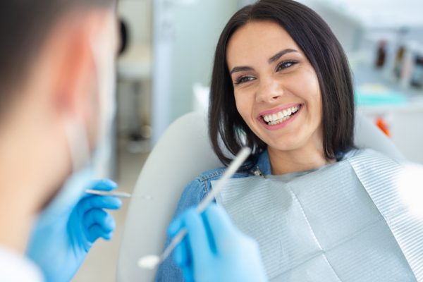 smiling patient in dental chair