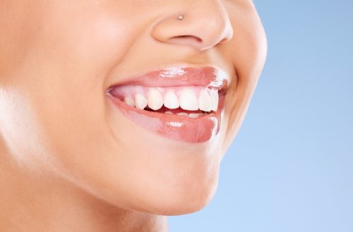 close up of a woman with nasal piercing smiling