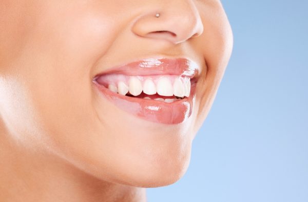 close up of a woman with nasal piercing smiling
